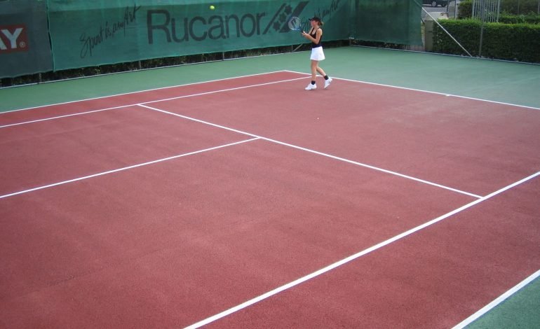 A player stands on a red hard-surface tennis court. Wandsworth Borough is announcing a new access scheme seeking to engage residents in more sport and activity across the borough.