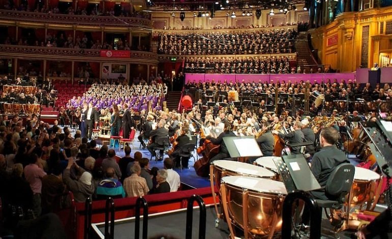 Aurora Orchestra performing Beethoven’s Ninth Symphony at the Royal Albert Hall during the BBC Proms, with a large choir and audience in the background