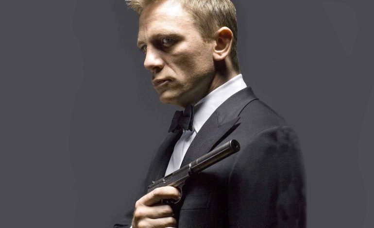 Daniel Craig as James Bond in a classic black tuxedo, exuding confidence and sophistication.