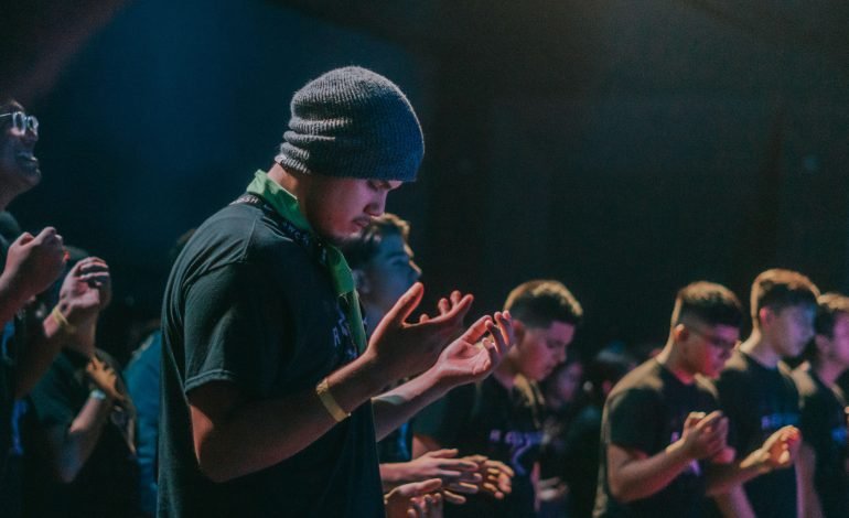 London youths participating in a creative activity at a youth club event
