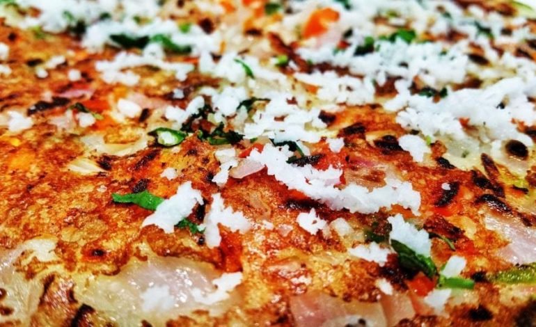 Delicious close up of a traditional Indian dosa, a perfect example of affordable dining at cheap restaurants to visit in London.