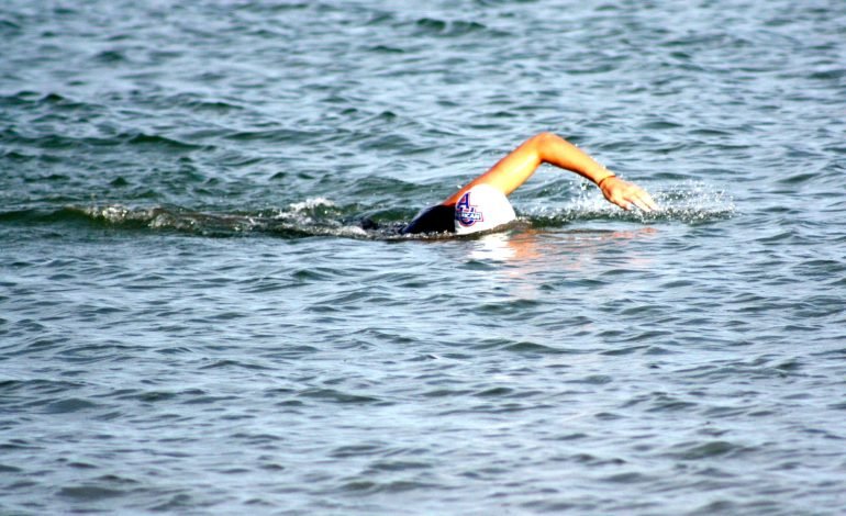 Kristof Rasovszky swimming in open water during the 10km marathon at the Paris 2024 Olympics.