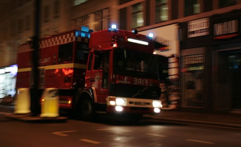 London fire engine responding to a major incident in Dagenham, where over 200 firefighters battled a large blaze in a building with known fire safety issues.