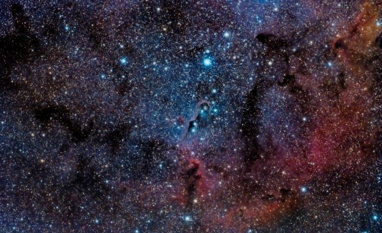 A stunning view of the universe filled with countless stars and cosmic dust, illustrating the concept of the Higgs Boson and its potential instability in the cosmos.
