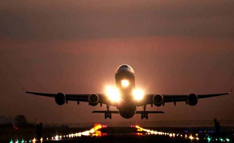 Airplane taking off at dusk, symbolising the return of 24 individuals freed in the largest post-Soviet prisoner swap between the U.S. and Russia.