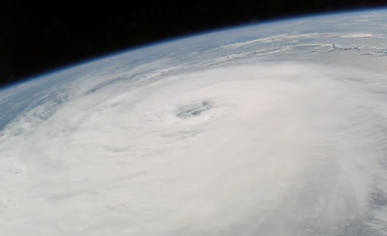 Aerial view of Hurricane Helene, showcasing its vast size and powerful eye as rescue efforts continue in the aftermath of the storm.