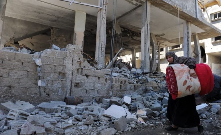 Damaged building following conflict, highlighting the need for an Israel and Hezbollah ceasefire.