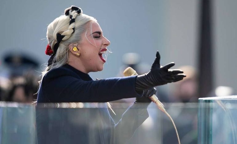 Lady Gaga performing live, promoting Lady Gaga’s new album inspired by her role as Harley Quinn