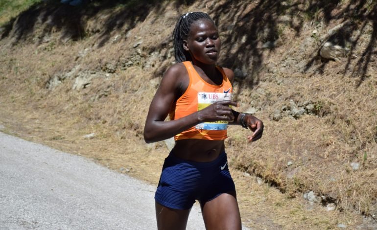 Olympic athlete Rebecca Cheptegei running during a marathon highlighting her athletic prowess before her tragic death after being set on fire by her ex boyfriend scaled.jpg