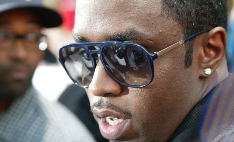 Sean Combs at a public event amid sex trafficking case, facing denied bail request.