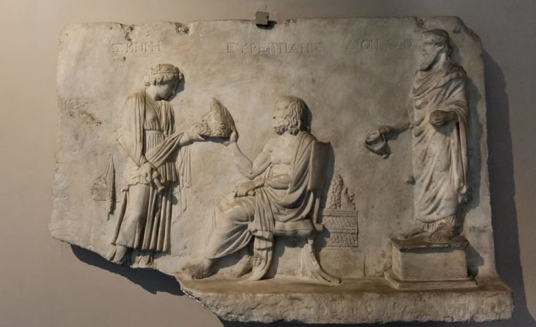 Ancient relief showcasing Greek figures, symbolising the era during which the new Euripides fragments were discovered