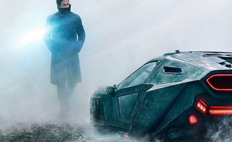 Scene from Blade Runner 2049 featuring a futuristic vehicle in a foggy landscape