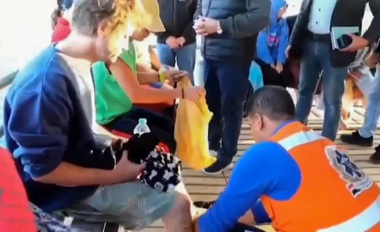 Survivors receiving aid after the Red Sea boat sinking near Marsa Alam, Egypt.