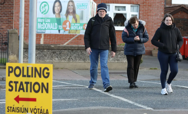 Voters walking towards a polling station in Dublin, highlighting Ireland's election.