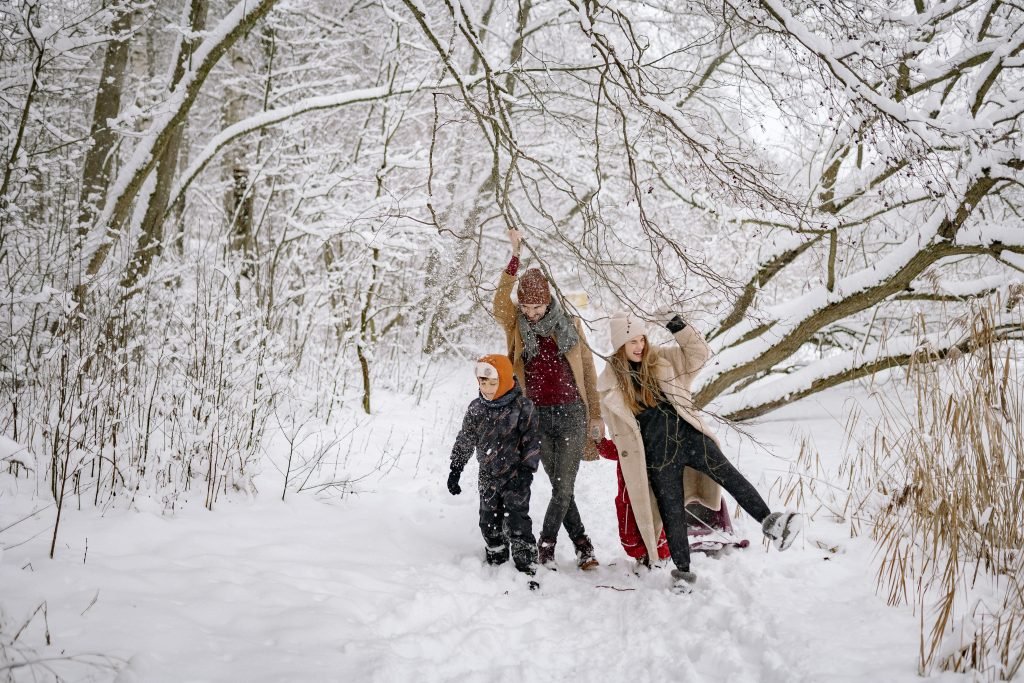 Family enjoying a peaceful countryside walk in the UK during Christmas.