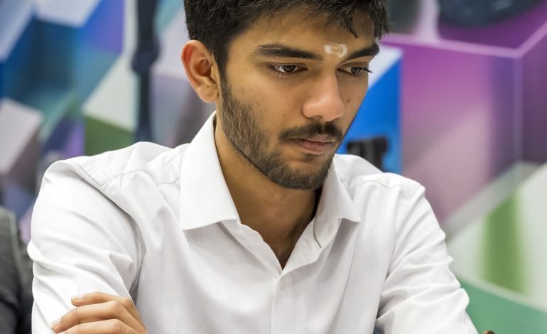 Gukesh D focuses intently during a chess game in 2024, showcasing his determination as he competes for the World Chess Championship.