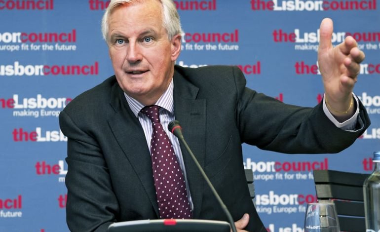 Michel Barnier addresses a conference, emphasising his role as French Prime Minister during a pivotal moment in political history.