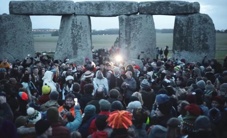 Winter solstice celebrations at Stonehenge, showcasing the alignment of ancient stones with celestial events in the Northern Hemisphere.
