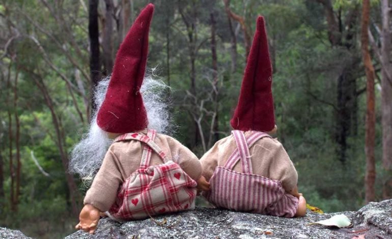 wo whimsical Christmas gnomes in a forest, rekindling Christmas magic through nostalgic and festive traditions.