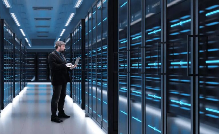 A data centre technician working inside a futuristic server room as OpenAI teams up with Oracle and SoftBank to advance AI infrastructure.