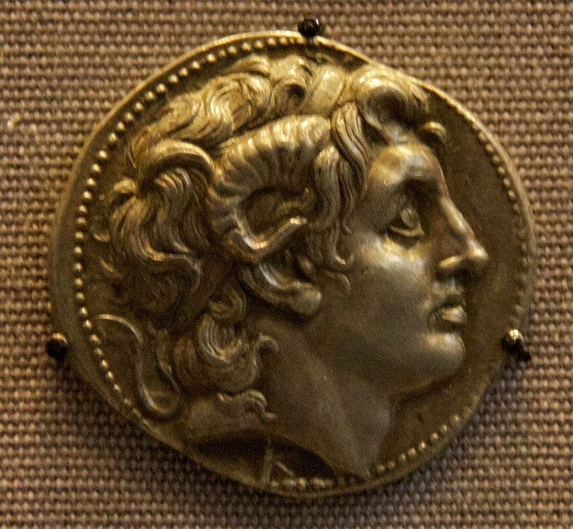 Ancient coin depicting Alexander the Great with ram’s horns symbolising Zeus Ammon, highlighting his divine status, from the Hellenistic period.