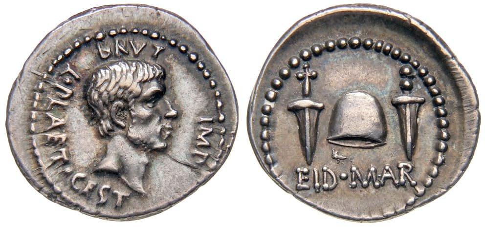 EID MAR denarius of Marcus Junius Brutus, minted in 44 BCE, featuring Brutus on the obverse and daggers with a liberty cap symbolising Caesar's assassination on the reverse.