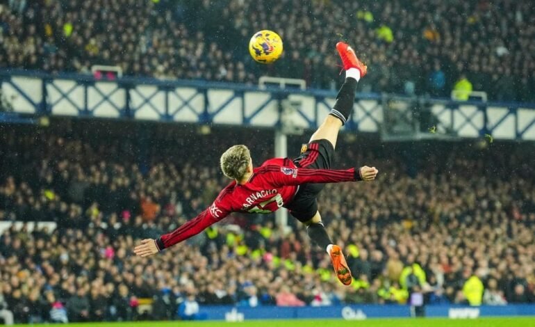 Manchester United's Alejandro Garnacho in action, a focal point of transfer news as Napoli pursue a £50m deal.