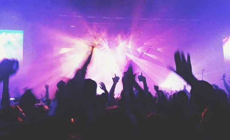 Crowd dancing under vibrant lights at Kensington High Street nightclub Gallery, a new hotspot in West London nightlife.
