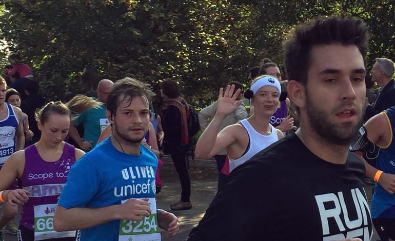 Runners participating in the Royal Parks Half Marathon 2025 in London, raising money for UK charities through Hyde Park