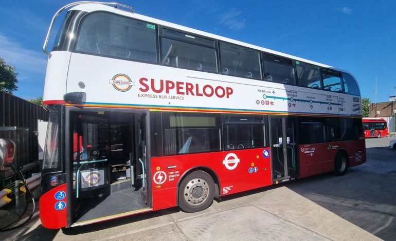 Electric red double decker bus promoting Superloop SL12 route express service in London with Heathrow on the route map