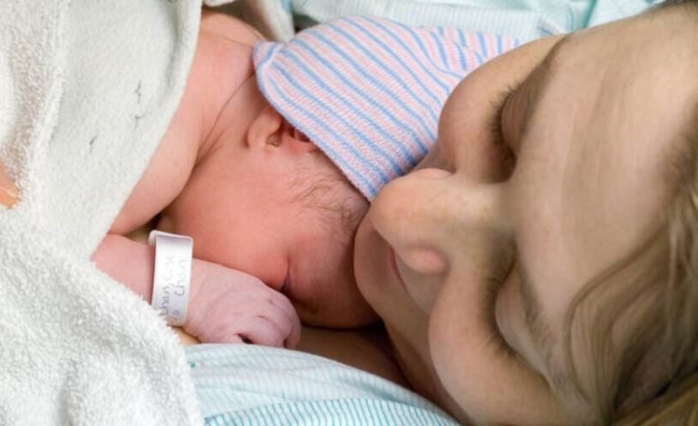 Postpartum female preference for cooler temperatures linked to brain changes