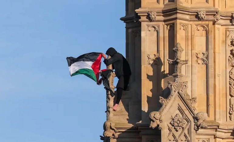 Protester scales Big Ben’s Elizabeth Tower, holding a Palestinian flag, during a demonstration in Westminster.