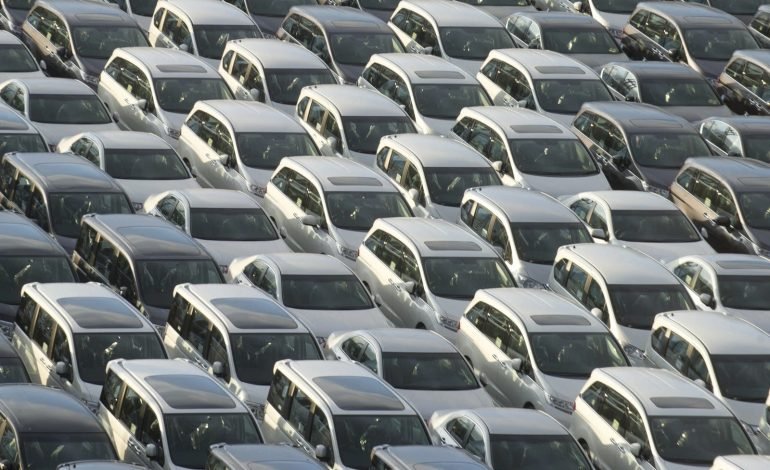 US tariffs UK car exports parked vehicles awaiting shipment at British dock