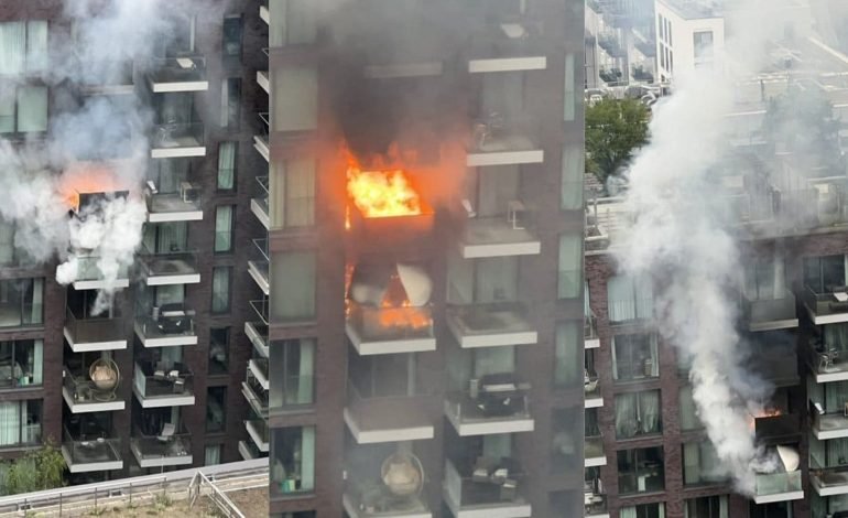 Fire breaking out in Aldgate high rise flats with smoke and flames spreading across multiple balconies