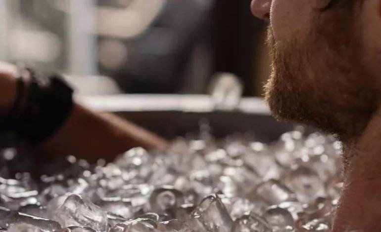 Man immersed in ice bath as part of cold plunges study on cellular health benefits