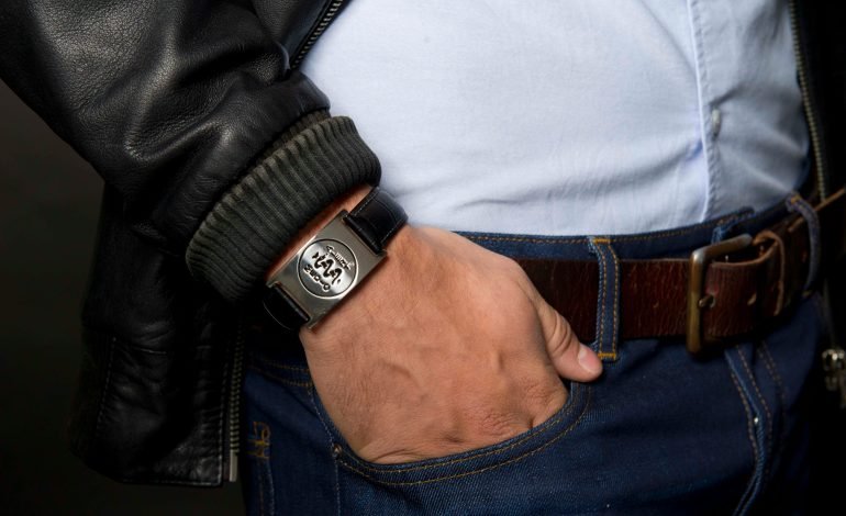 Man wearing medical ID bracelet representing support for UK men’s health strategy