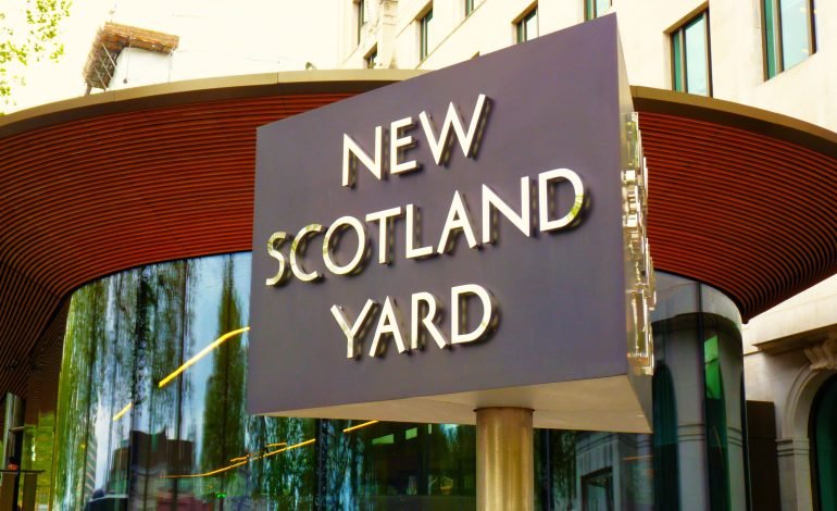 New Scotland Yard headquarters sign, central to Met Police under fire case involving Catherine Roper