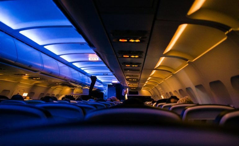 dark interior of an airplane with lights on