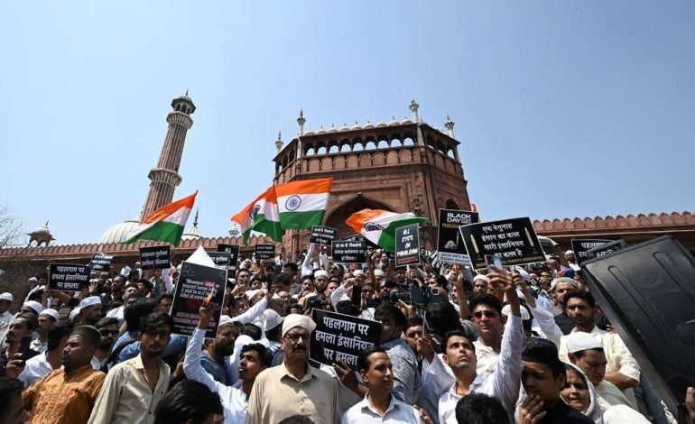 Protest crowd waving Indian flags during India–Pakistan tensions following cross border strikes