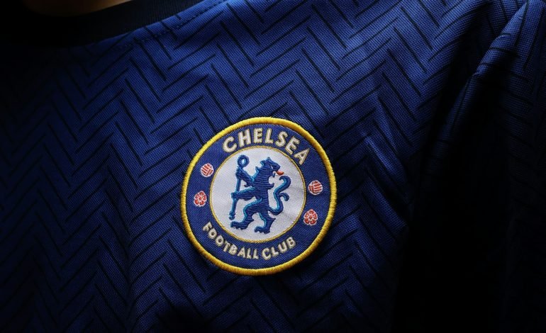 close up of chelsea badge on jersey the club who won the conference league