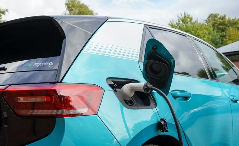 teal VW ID3 plugged in charging