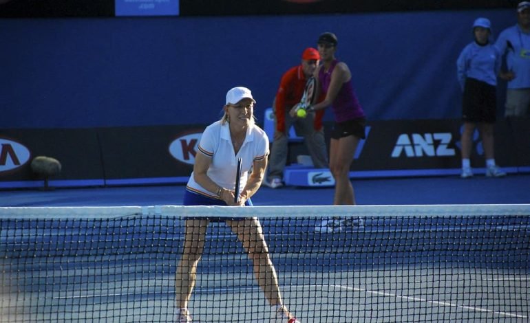 Martina Navratilova on court during a doubles match, reflecting the legacy of tennis legends like Navratilova
