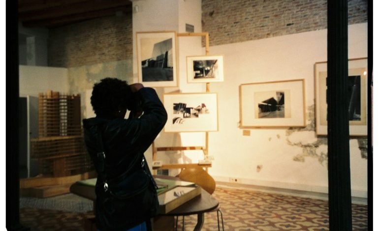 photographer taking picture of framed photos