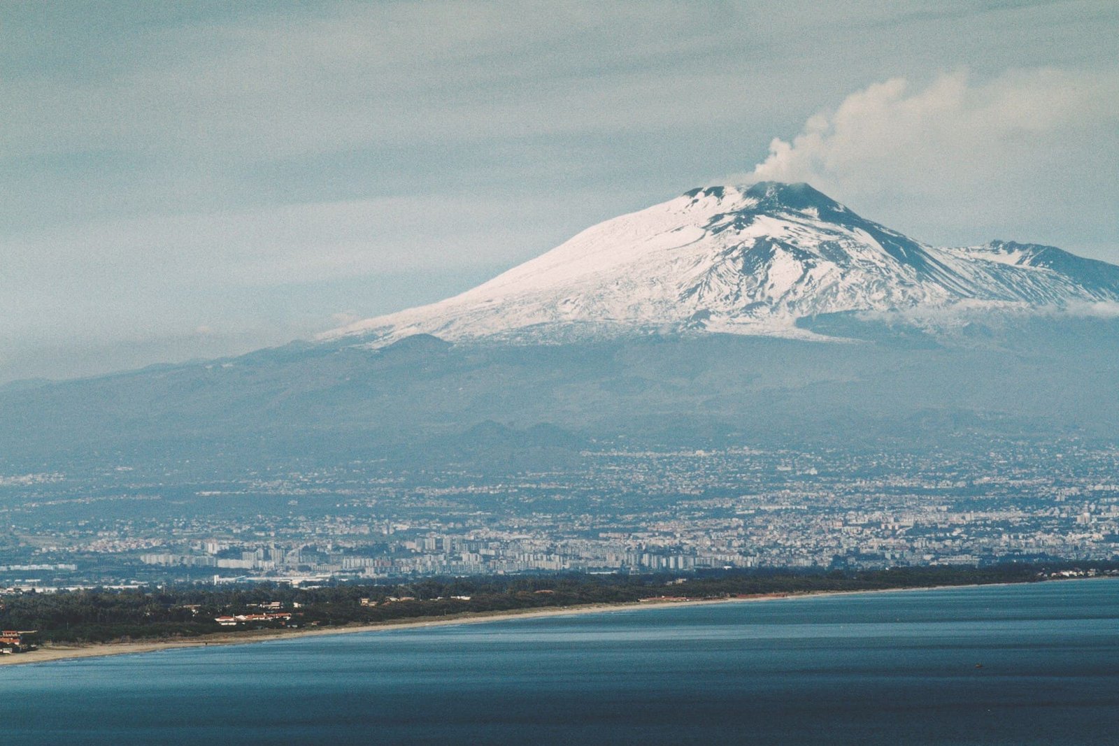 Mount Etna erupts, releasing ash plumes