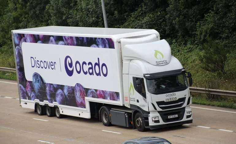 Ocado delivery lorry on a UK motorway promoting Ocado services