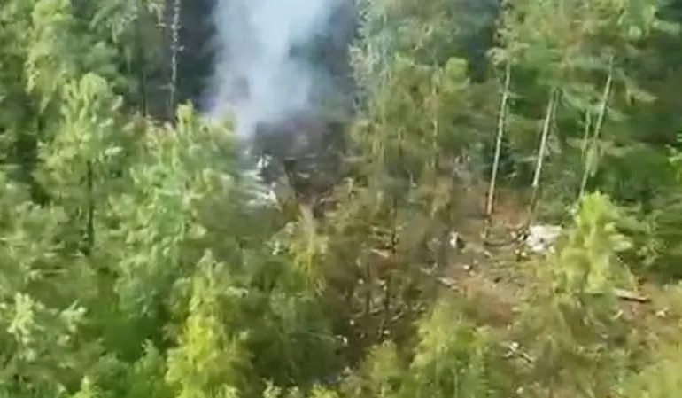 Wreckage site from Amur region plane crash investigation in dense forest