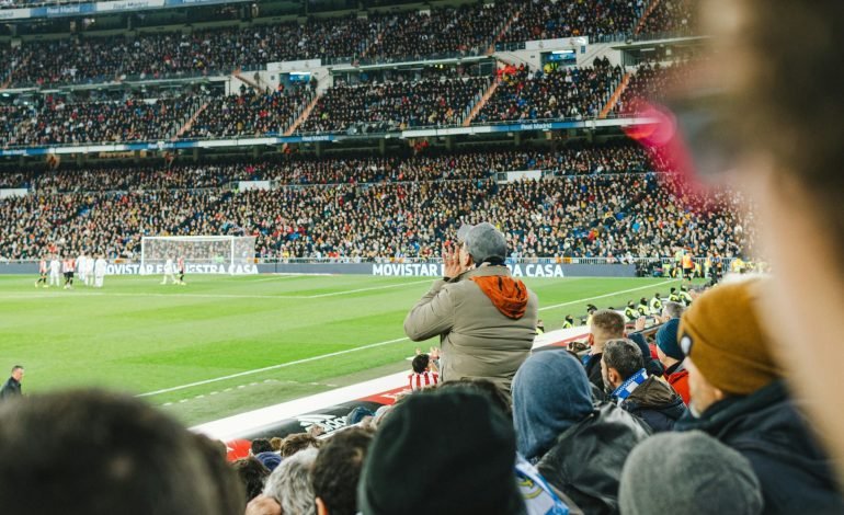 football clubs fans watching a match in the stadium