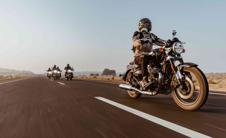 royal enfield bikes riding on a road