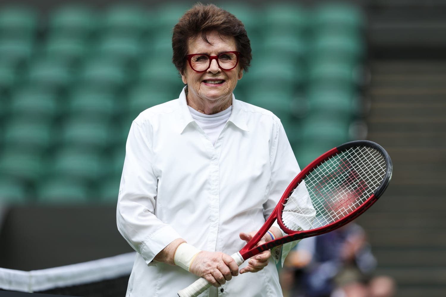 Billie Jean King holding a tennis racket at Wimbledon, symbolising gratitude and resilience in sport and life.