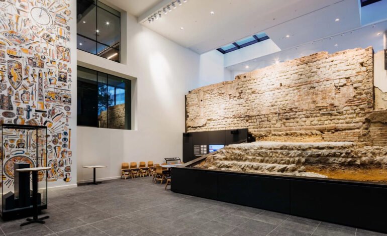 Roman City Wall exhibition Vine Street London showing preserved Roman wall remains inside gallery space